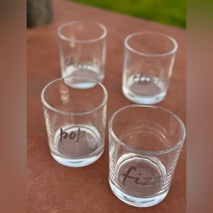 Set of 4 celebration glasses. Metallic lettering says Fiz, Pop, Cink and Cheers